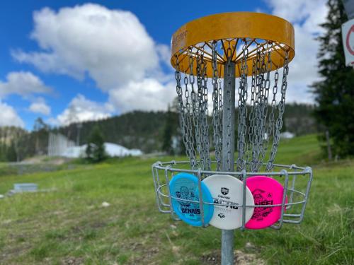 a group of frisbees in a net on a field at Lomakivakka - Roomy 2BD & loft by the lake, free wifi and sauna in Ruka