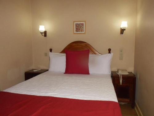 Postel nebo postele na pokoji v ubytování Hotel Larbelo
