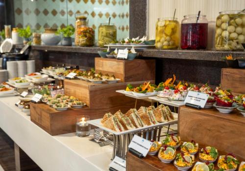 a buffet line with many different types of food at Distrikt 9 in Palakkad