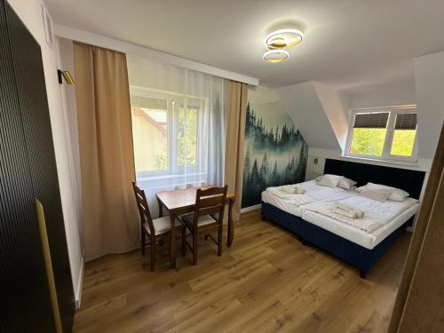 Postel nebo postele na pokoji v ubytování Pod Brzozka