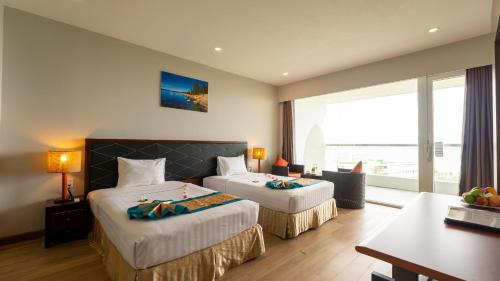 Postel nebo postele na pokoji v ubytování Sandunes Beach Resort & Spa