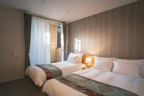 Voodi või voodid majutusasutuse 谷町君Hotel 京都駅東29 toas