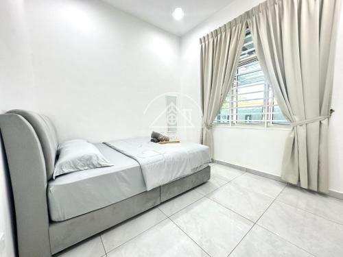 a white bedroom with a bed and a window at PD Homestay 14Pax with private swimming pool in Port Dickson