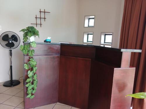 a altar in a church with a green plant at Blue Sky Manor in Roodekrans