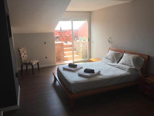 Ένα ή περισσότερα κρεβάτια σε δωμάτιο στο Villa Escandinavia