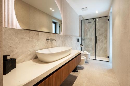 a bathroom with a sink and a toilet at Villa Brela-Rogac 1 in Baška Voda