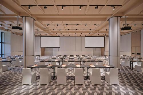 a large conference room with tables and chairs at Hyatt Centric Zhongshan Park Shanghai in Shanghai