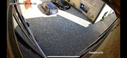 an overhead view of a car parked in a driveway at Stylové ubytování v historickém centru Litomyšle in Litomyšl