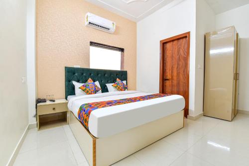 a bedroom with a large bed in a room at FabHotel Prince 24 in Mohali