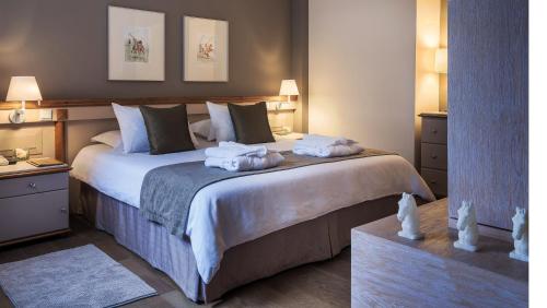 Katil atau katil-katil dalam bilik di Alasia Boutique Hotel