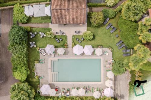 an overhead view of a swimming pool in a park at Hotiday Room Collection - Stresa in Stresa