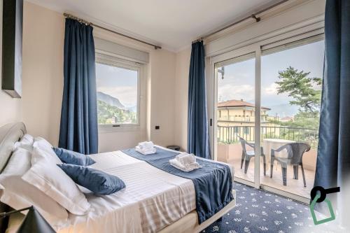 Postel nebo postele na pokoji v ubytování Hotiday Room Collection - Stresa