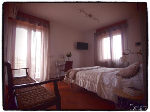 Postel nebo postele na pokoji v ubytování B&B Susanna
