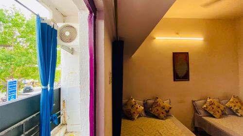Ένα ή περισσότερα κρεβάτια σε δωμάτιο στο Yadav homestay