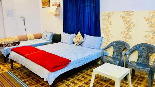 Ένα ή περισσότερα κρεβάτια σε δωμάτιο στο Yadav homestay