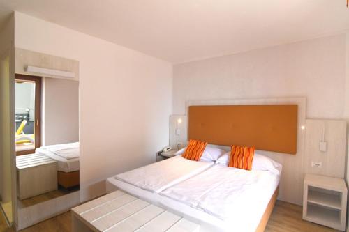 Postel nebo postele na pokoji v ubytování Hotel Da Tino