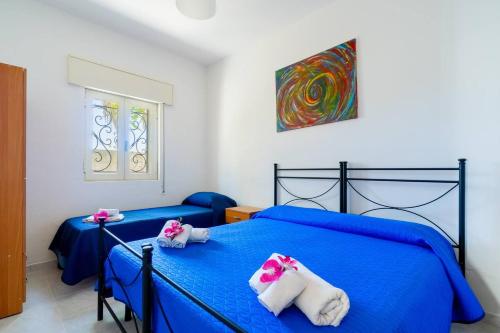 Postel nebo postele na pokoji v ubytování Villa Iris Punta Prosciutto