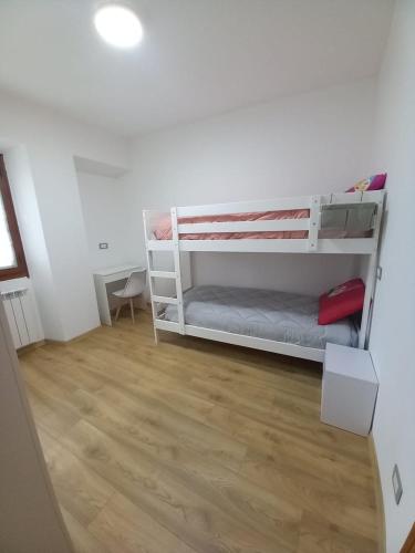 Ένα ή περισσότερα κρεβάτια σε δωμάτιο στο Casa Vacanze Cá Andriöi