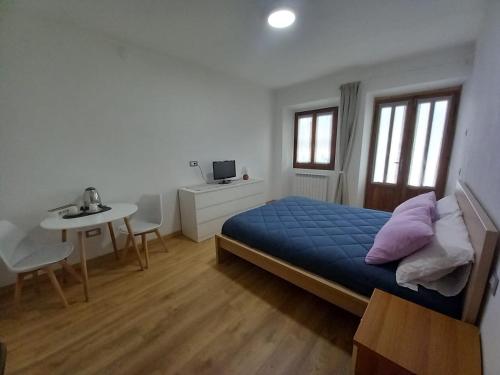 Ένα ή περισσότερα κρεβάτια σε δωμάτιο στο Casa Vacanze Cá Andriöi