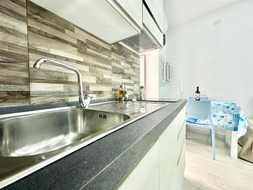 a kitchen with a sink and a counter top at Ale & Andry House in Cefalù