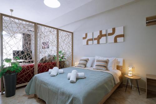Ένα ή περισσότερα κρεβάτια σε δωμάτιο στο Casa Calma Kavala