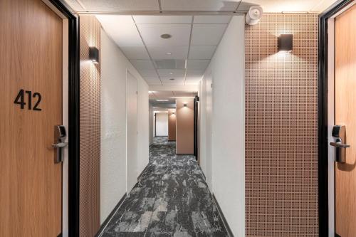a corridor of a corridor of a hallway with at ibis Nice Aéroport Promenade des Anglais in Nice