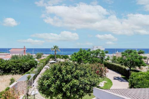 a view of the beach from the balcony of a resort at Pietramare Luxury Suites in Bari