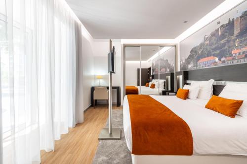 Jupiter Lisboa Hotel - Rooftop & Spaにあるベッド