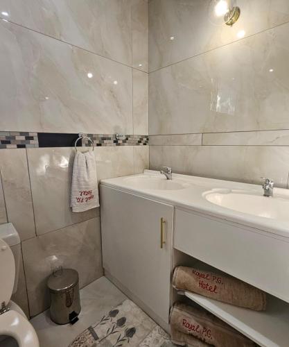 a bathroom with a tub and a sink and a toilet at The Royal Princess B&B on Malibongwe Drive in Johannesburg