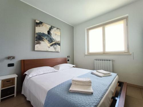 Ένα ή περισσότερα κρεβάτια σε δωμάτιο στο IseoLakeRental - Panorama House