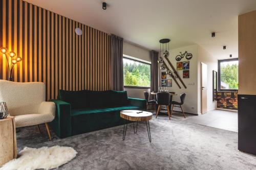 Posezení v ubytování Malinô Apartments - Chalets in Ski & Bike Park