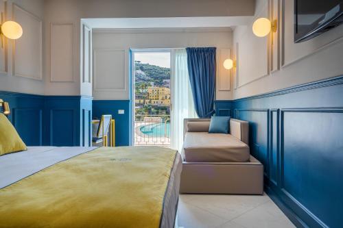 a bedroom with a bed and a window with a view at Hotel Mary in Vico Equense