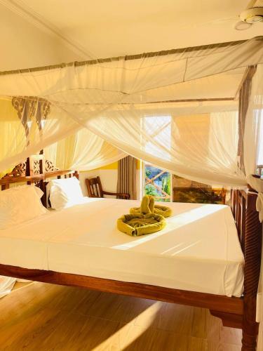 Кровать или кровати в номере Villa Vanilla Kendwa