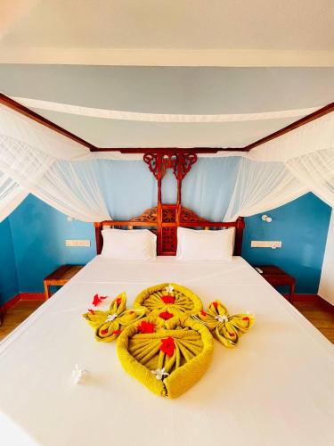 Кровать или кровати в номере Villa Vanilla Kendwa