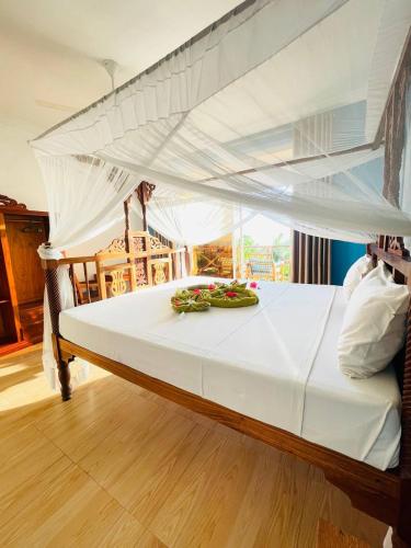 Кровать или кровати в номере Villa Vanilla Kendwa