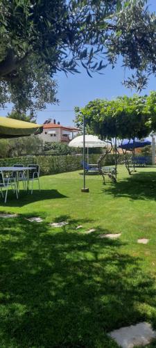 a park with a picnic table in the grass at BS Village in Metamorfosi