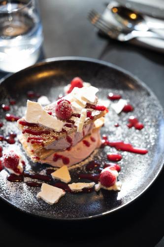 a plate with a piece of dessert on a table at Hôtel Spa Restaurant Villa Castellane in Gréoux-les-Bains