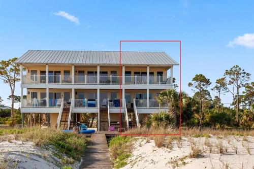 a large house on the beach next to the sand at Sun&Fun - Oceanfront, Quiet beach, Arcade games in Indian Pass