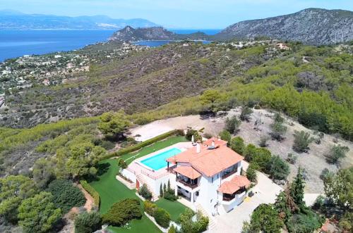 an aerial view of a house with a swimming pool at Lahtagas Estate with private swimming pool in Loutraki
