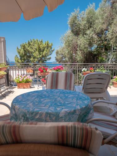 a table and chairs sitting on a patio at Apartments Marina in Sveti Stefan