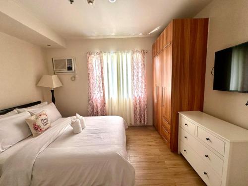 Postel nebo postele na pokoji v ubytování Matina Enclaves Residences