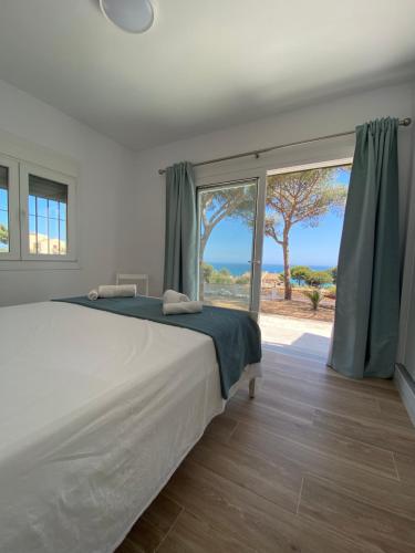 Postel nebo postele na pokoji v ubytování BEACH HOUSE EL BOSQUE