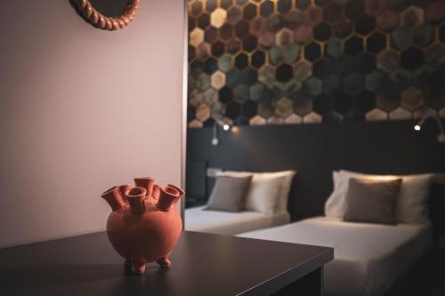 a vase sitting on a table in a living room at Testani Guest House Special in Anagni