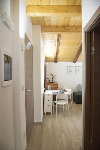 a room with a table and a dining room at La casa nel Monferrato "LA CONTENTËSSA" in Asti