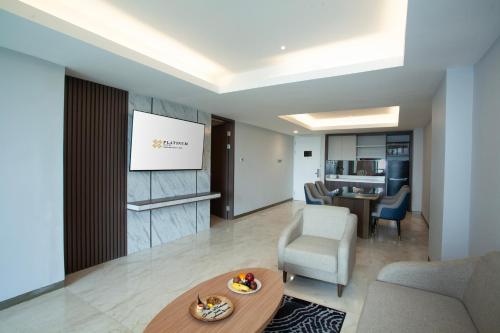 a living room with a couch and a table at Platinum Hotel Jimbaran Beach Bali in Jimbaran