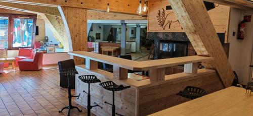 a living room with a fireplace in a house at Le Chalet du Ticou in Bolquere Pyrenees 2000
