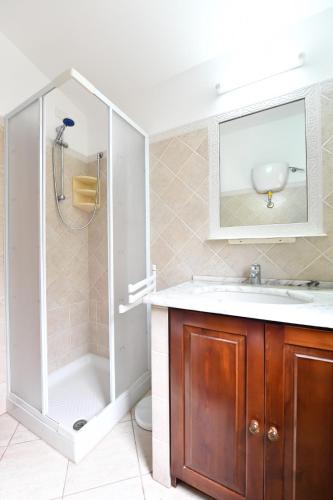 a bathroom with a sink and a shower at Casa Perassi in Putzu Idu