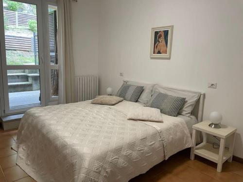 Postel nebo postele na pokoji v ubytování Casa Ambra, 50m vom Comer See, 2 private Parkplätze
