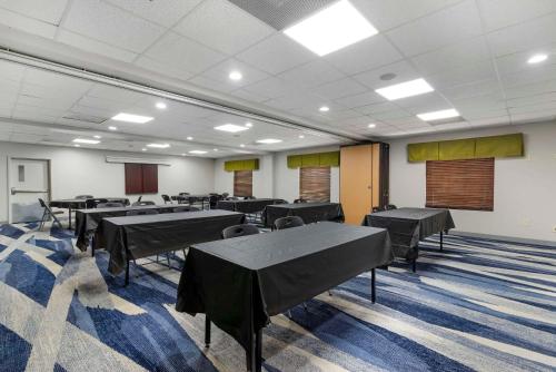 a conference room with tables and chairs in it at Comfort Suites Atlanta Airport in Forest Park