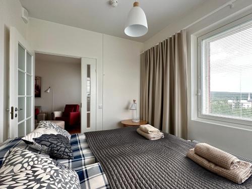 Postel nebo postele na pokoji v ubytování Aurora Sky Apartment